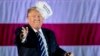President-elect Donald Trump throws a hat into the audience while speaking at a rally at Baton Rouge (La.) Metropolitan Airport, Dec. 9, 2016.
