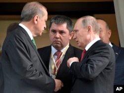 FILE - Turkish President Recep Tayyip Erdogan, left, speaks to Russian President Vladimir Putin, right, as he leaves after their meeting in Putin's residence in the Russian Black Sea resort of Sochi, Russia, Wednesday, May 3, 2017.