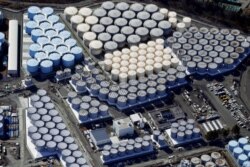 An aerial view shows the storage tanks for treated water at the tsunami-crippled Fukushima Daiichi nuclear power plant in Okuma town, Fukushima prefecture, on February 13, 2021.
