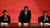 2012年5月周永康（中）、李克强和刘云山（左）在庆祝中国共青团成立90周年大会上被一一介绍。