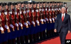U.S. Vice President Mike Pence attends a welcome ceremony at Golubovci airport, near Podgorica, Montenegro, Aug. 1, 2017. Pence will attend the Adriatic Charter Summit in NATO's newest member — Montenegro, on Wednesday.