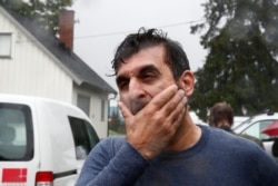 Mosque board member Irfan Mushtaq reacts after a shooting in al-Noor Islamic center mosque, near Oslo, Norway, Aug. 10, 2019.