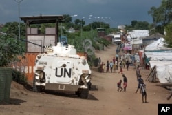 FILE-In this file photo taken Monday, July 25, 2016, A UN armoured personnel vehicle stand in a refugee camp in Juba South Sudan.