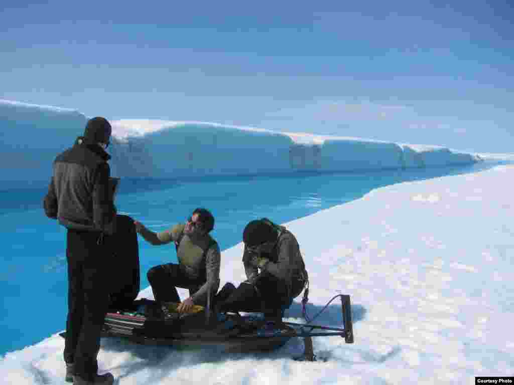 Meltwater drains from Greenland’s ice sheet at such a fast rate that researchers couldn’t risk entering the water to get readings so they used a remote-controlled drone boat. (UCLA/ Laurence C. Smith)