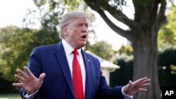 FILE - President Donald Trump speaks with reporters on the South Lawn of the White House, in Washington, Sept. 16, 2019.