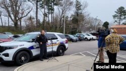 FILE - An officer of the Virginia Beach Police Department speaks to local reporters, in Virginia Beach, Virginia, March 23, 2021. (VBPD Facebook page)