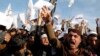 FILE - In a protest earlier this year at Afghanistan's Nangarhar University, students chant slogans critical of the satirical French weekly Charlie Hebdo, which had featured a cartoon of the Prophet Muhammad on its cover, Jan. 18, 2015.