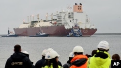 FILE - The giant LNG ship Al Nuaman, which carries 200,000 cubic meters of liquefied gas, arrives in the Baltic port of Swinoujscie, Poland, Dec. 11, 2015, after 21 days of travel from Qatar. 
