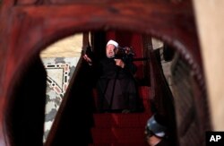 FILE -- In this Dec. 28, 2012, photo, Shiekh Youssef al-Qaradawi, gives the sermon during the Friday prayer at Al-Azhar mosque in Cairo, Egypt.