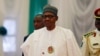 Le président Muhammadu Buhari assiste à l'ouverture de la 56e session ordinaire de l'Autorité des chefs d'État et de gouvernement de la CEDEAO à Abuja, Nigeria, le 21 décembre 2019.