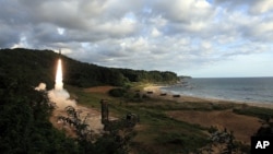 In this photo provided by the South Korea Defense Ministry, South Korea's Hyunmoo II ballistic missile is fired during an exercise at an undisclosed location in South Korea, Sept. 15, 2017.