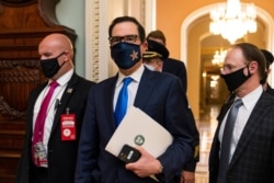 FILE - Treasury Secretary Steven Mnuchin makes a brief comment as he leaves the Capitol, Sept. 30, 2020, in Washington.