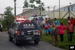 Relatives of prisoners wait for information outside the Anisio Jobim Penitentiary Complex in Manaus, Brazil, Jan. 2, 2017.