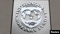 FILE - The International Monetary Fund (IMF) logo is seen at the IMF headquarters building. 