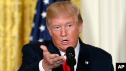 FILE - In this photo taken Aug. 28, 2017, President Donald Trump speaks in the East Room of the White House in Washington. Trump later said "all options are on the table" in terms of a U.S. response to North Korea's launch of a missile over Japan.