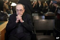 FILE - Cardinal Philippe Barbarin waits for the start of his trial at the Lyon courthouse, central France, Jan. 7, 2019.