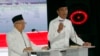Presiden Joko Widodo (kanan) didampingi cawapres Ma'ruf Amin (kiri) dalam Debat Capres Cawapres 2019 di Jakarta, Sabtu, 13 April 2019. (Foto: AP)