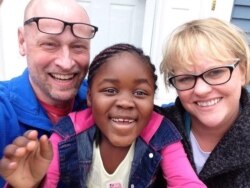 Steve and Melissa Pederson smile for a photo with their adoptive daughter Monique. (Courtesy - Steve Pederson)