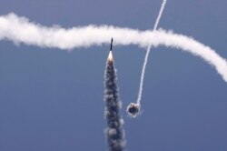 Israel's Iron Dome aerial defense system intercepts a rocket launched from the Gaza Strip, controlled by the Palestinian Hamas movement, above the southern Israeli city of Ashkelon.
