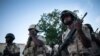 FILE - Soldiers perform their duties at the Multinational Joint Task Force base in Mora, Cameroon, Sept. 28, 2018. 