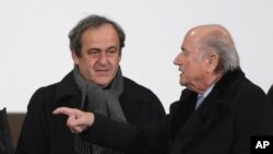 FILE - UEFA president Michel Platini, left, and FIFA president Sepp Blatter on Dec. 16, 2014.