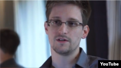 NSA whistleblower Edward Snowden giving an interview about why he leaked intelligence information.