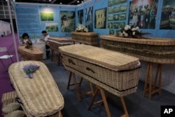 Wicker and seagrass coffins are displayed at the Asia Funeral and Cemetery Expo & Conference in Hong Kong, May 18, 2017. The expo underscores how for some investors Asia's rapidly aging population makes its death industry a potentially lucrative market.