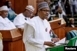 FILE - Nigerian President Muhammadu Buhari speaks at the National Assembly, in Abuja, Nigeria, Dec. 19, 2018.