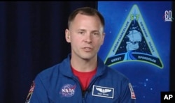 In this frame from video from NASA TV, NASA astronaut Nick Hague, who survived the Oct. 11, 2018, failed launch and emergency landing, speaks from the NASA Johnson Space Center in Houston, Oct. 16, 2018.