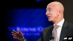 FILE- In this Sept. 13, 2018, file photo Jeff Bezos, Amazon founder and CEO, speaks at The Economic Club of Washington's Milestone Celebration in Washington.