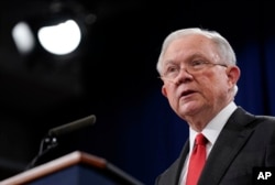 Attorney General Jeff Sessions speaks during a news conference to announce a criminal law enforcement action involving China, at the Department of Justice in Washington, Nov. 1, 2018.