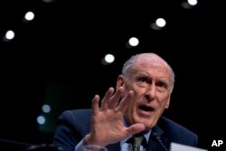 Director of National Intelligence Dan Coats speaks at a Senate Select Committee on Intelligence hearing on worldwide threats, in Washington, Feb. 13, 2018.
