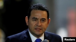 FILE - Guatemala's President Jimmy Morales speaks to the media in Quito, Ecuador, May 23, 2017.