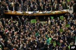 Opposition lawmakers celebrate after the lower house of Congress voted to impeach Brazil's President Dilma Rousseff in the Chamber of Deputies in Brasilia, Brazil, April 17, 2016.