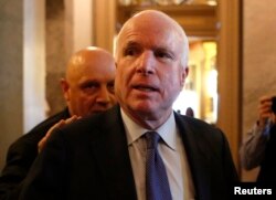 FILE - U.S. Senator John McCain (R-AZ) leaves the Senate floor on Capitol Hill, in Washington, Dec. 9, 2014.