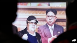 A TV screen shows pictures of North Korean leader Kim Jong Un and his older brother Kim Jong Nam, left, at the Seoul Railway Station in Seoul, South Korea, Feb. 14, 2017