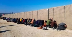 This photo provided by the Kurdish-led Syrian Democratic Forces shows some Islamic State group fighters, who were arrested by the Kurdish-led Syrian Democratic Forces after they attacked Gweiran Prison, in Hassakeh, northeast Syria, Jan. 21, 2022.