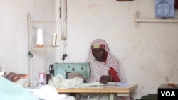 Falmata Mustapha received a sewing machine from Hajia Hawa. She's been able to earn some money as a tailor to support her children, Maiduguri, Nigeria, Sept. 2016. (Photo: C. Oduah)