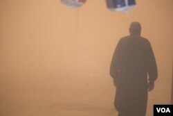 Abu Mohammad walks a kilometer home through the storm, saying he is used to the weather, in al-Shadady, Syria, Oct. 28, 2017. (H. Murdock/VOA)