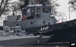 FILE - Damage on one of three Ukrainian ships is seen after they were seized seized in a standoff with the Russian navy in the Black Sea, Nov. 25, 2018, in Kerch, in Russia-annexed Crimea.