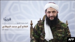 An image released July 28, 2016, by Al-Manara al-Bayda, the official news arm of Al-Nusra Front, al-Qaida's Syrian affiliate, allegedly shows the group's chief Abu Mohammad al-Jolani at an undisclosed location, in the first ever picture to be released of him.