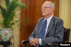Peruvian President Pedro Pablo Kuczynski gives an interview to the media at the Government Palace in Lima, Dec. 17, 2017.