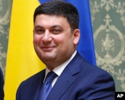 FILE - Ukraine's Prime Minister Volodymyr Groysman may struggle to get unpalatable pension reforms requested by the IMF through parliament, which include ending early retirement privileges for teachers and doctors.