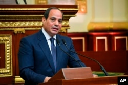 FILE- Egyptian President Abdel-Fattah el-Sissi addresses Parliament after being sworn in for a second four-year term, in Cairo, Egypt, in this June 2, 2018, photo provided by the media office of Egypt's presidency.