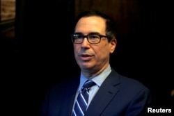 FILE - U.S. Treasury Secretary Steven Mnuchin speaks during his interview with Reuters in Jerusalem, Oct. 21, 2018.