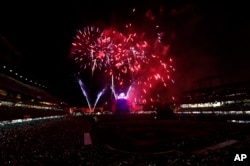 Fireworks explode over Coors Field to mark the Independence Day holiday after the Colorado Rockies hosted the Cincinnati Reds in a baseball game, July 3, 2017, in Denve, Colorado.