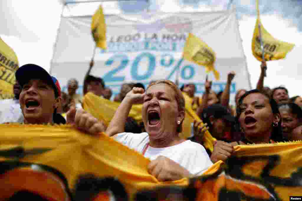 Opposition supporters shout slogans, during a gathering to demand a referendum to remove President Nicolas Maduro, in Caracas, Venezuela.