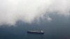 FILE - A tanker travels through the Singapore Strait.