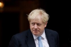 FILE - British Prime Minister Boris Johnson walks outside before a meeting at 10 Downing Street in London, Oct. 15, 2019.
