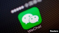 FILE - A picture illustration shows a WeChat app icon in Beijing, Dec. 5, 2013. 